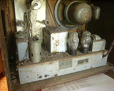 Close-up rear view of radio before restoration.